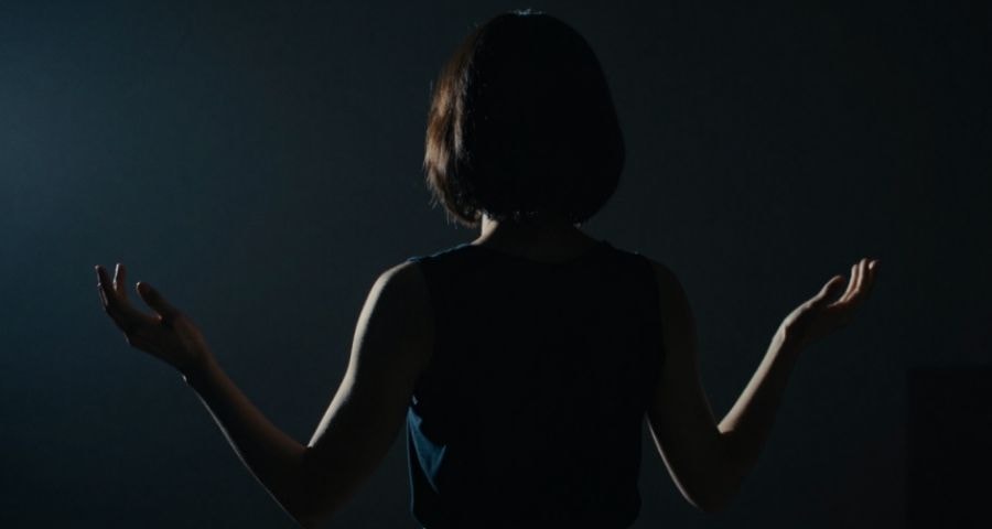 Hands slowly unclenching, releasing tension